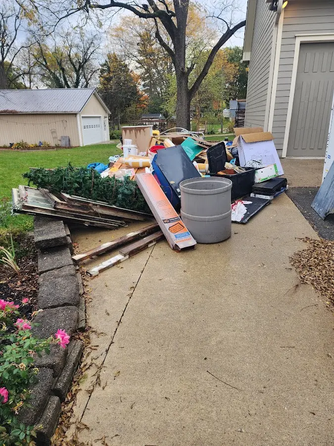 Dumpster being loaded with debris for Commercial Dumpster Rental in Willowbrook